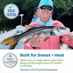 Person holding a fish on a boat with promotional text about waxhead sunscreen, set against a natural background.