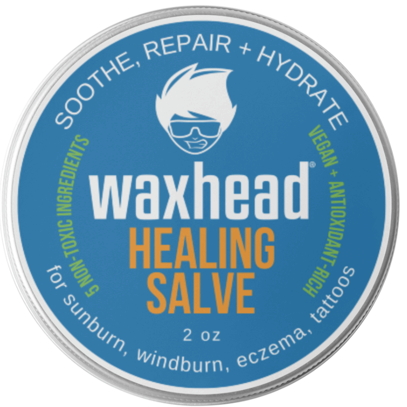 Waxhead Healing Salve container with blue label and silver rim