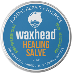 Waxhead Healing Salve container with blue label and silver rim