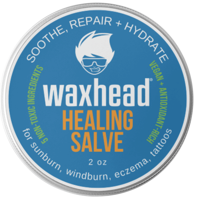 Waxhead Healing Salve container with blue label and silver rim