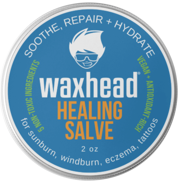 Waxhead Healing Salve container with blue label and silver rim
