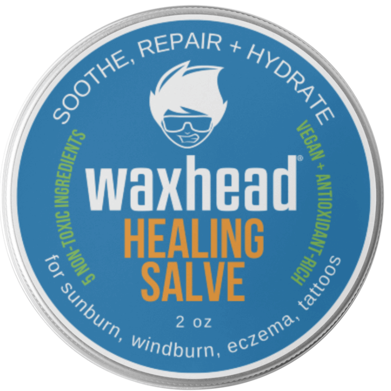 Waxhead Healing Salve container with blue label and silver rim
