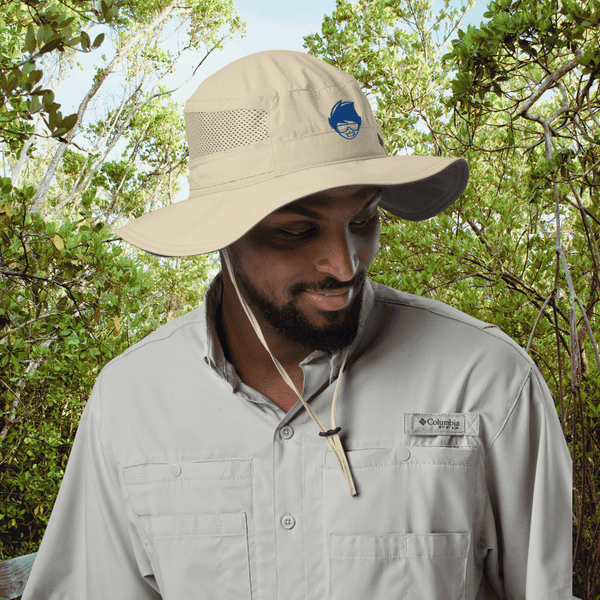 Man wearing tan Columbia Booney Hat for sun protection while hiking outdoors