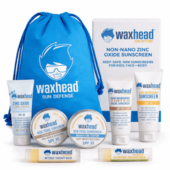 Waxhead Sun Defense product set including sunscreen bottles, a blue drawstring bag, and a red bow on a white background.