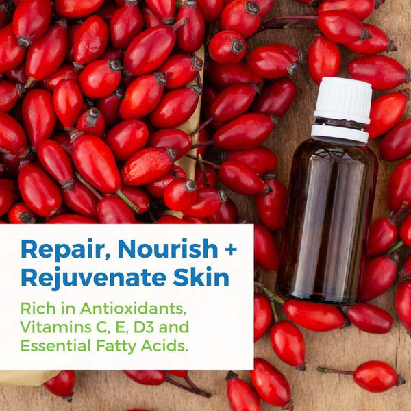 Organic Rosehip Seed Oil Serum with CoQ10 surrounded by rose hip berries, promoting skin repair and nourishment.
