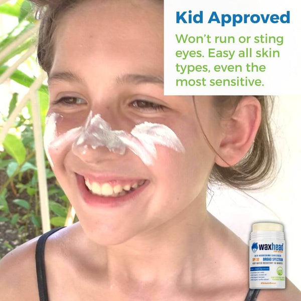 Child smiling with zinc sunscreen on face, promoting Reef Safe Zinc Sunscreen Stick as kid approved for all skin types.