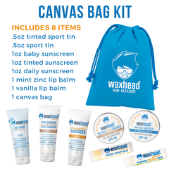 Canvas bag kit with Waxhead sun defense products on a white background