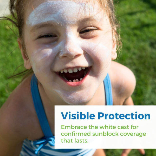Child smiling with sunscreen on face, showcasing visible protection from Bulk Sunscreen Gallon.
