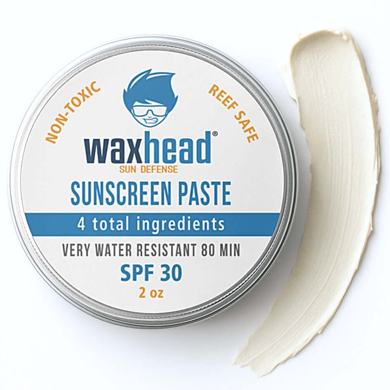 Zinc Oxide Sunscreen Paste by Waxhead in a 2oz tin with a creamy texture and SPF 30 label.