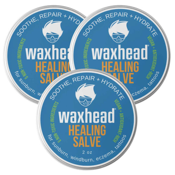 Three tubs of Waxhead Healing Salve showcasing soothing, repairing, and hydrating benefits for skin care.
